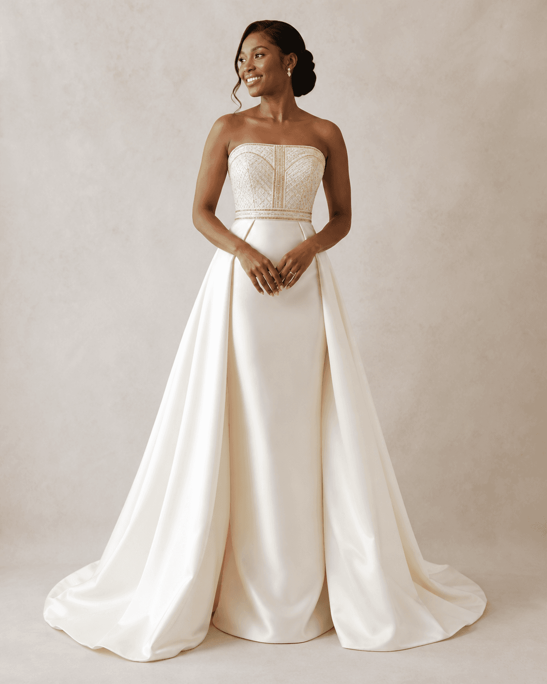 Bride wearing the Adom ivory and gold gown