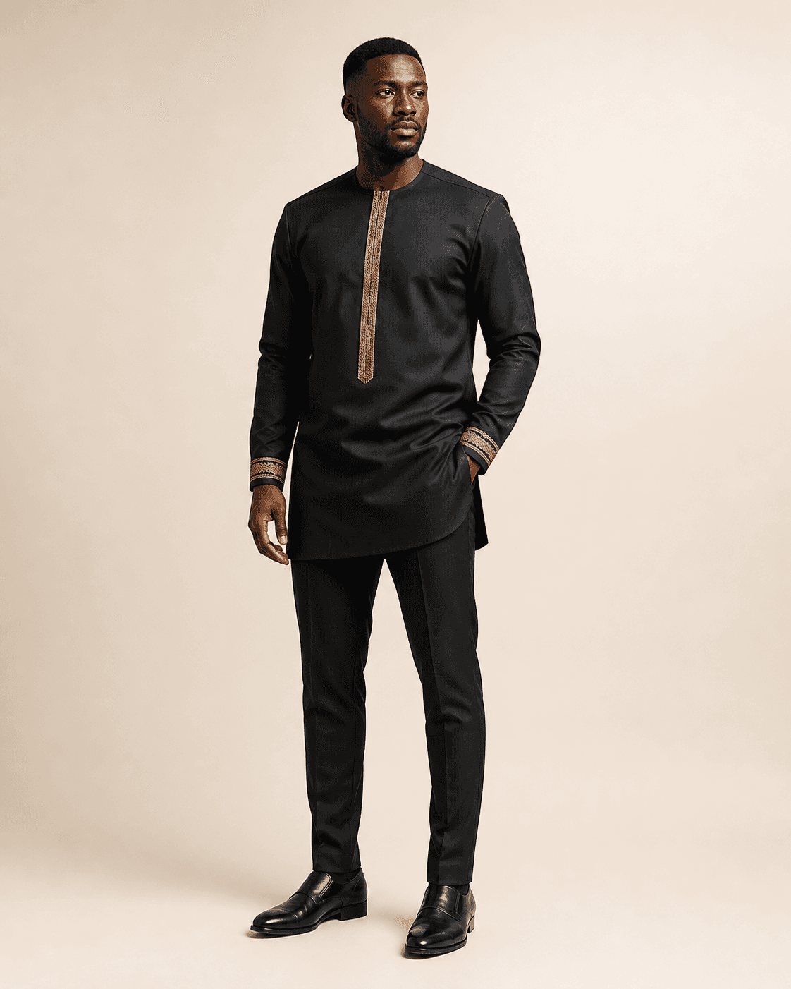 Man wearing the Kofi black and gold kaftan set