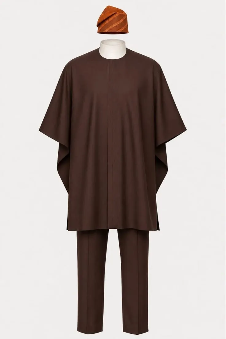 Chocolate brown agbada and trousers with a rust fila cap on a mannequin
