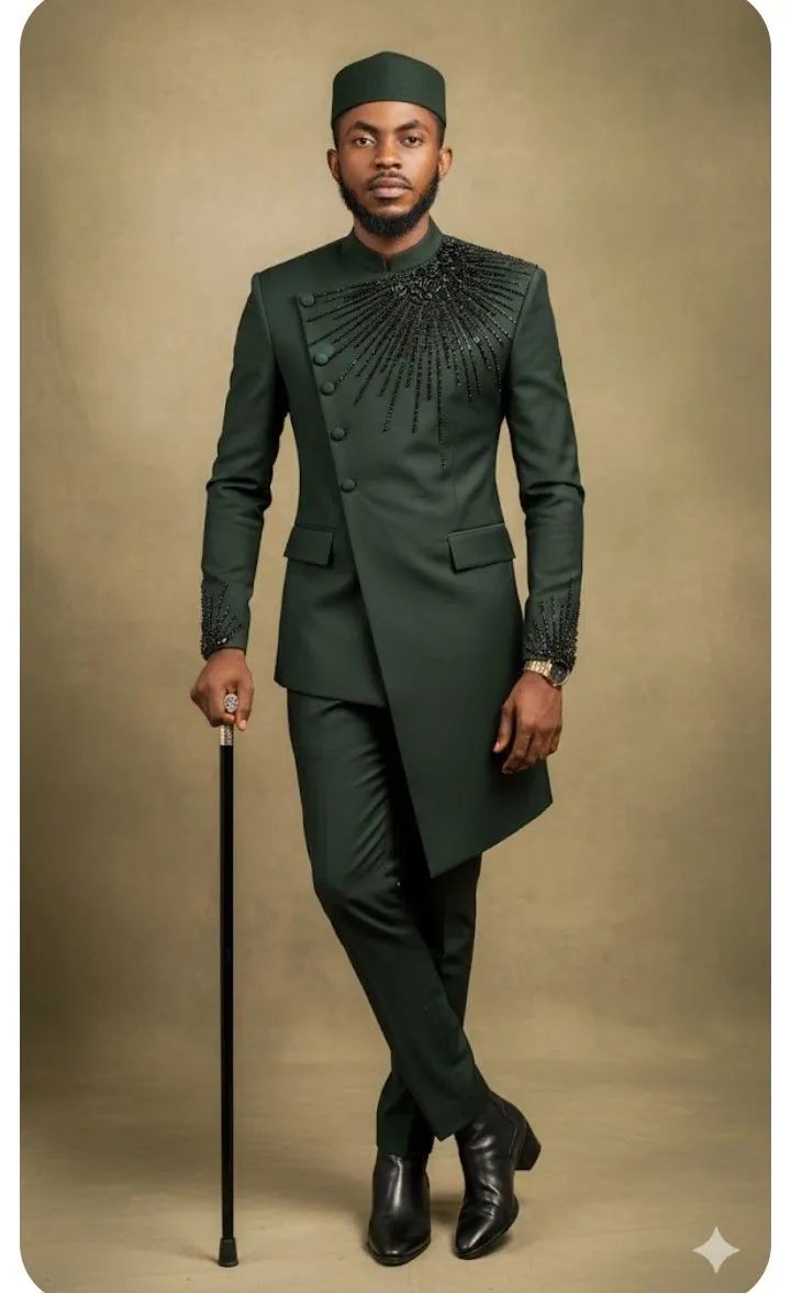 Man in a forest green suit with embroidered chest detail and matching cap