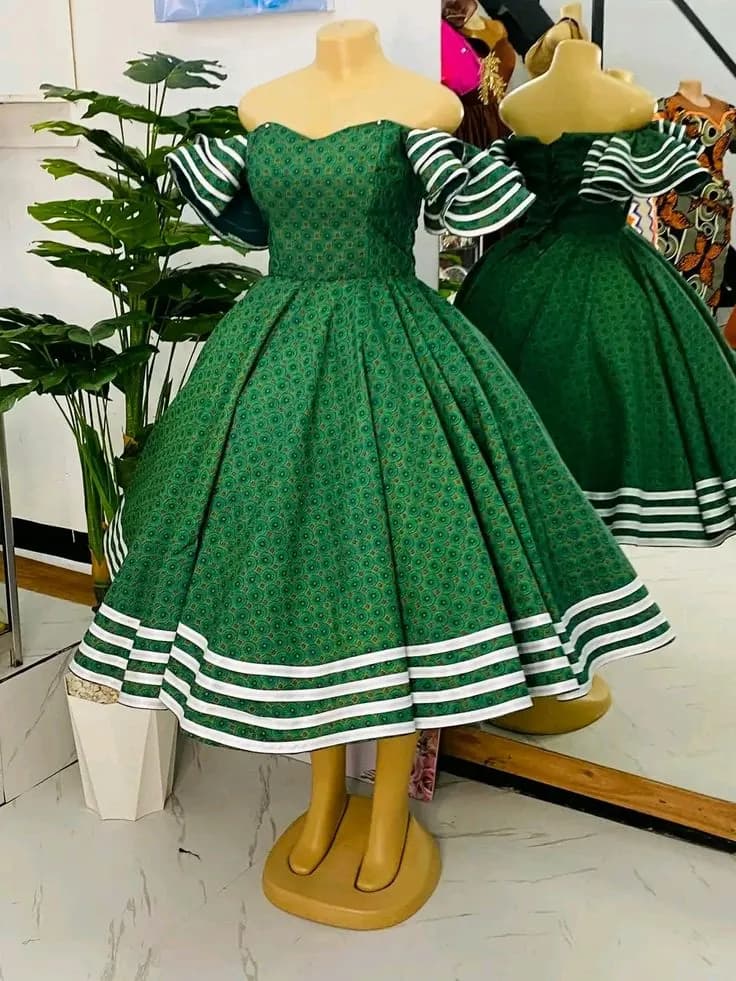Green printed off-shoulder tea dress with white striped hem and sleeve trims