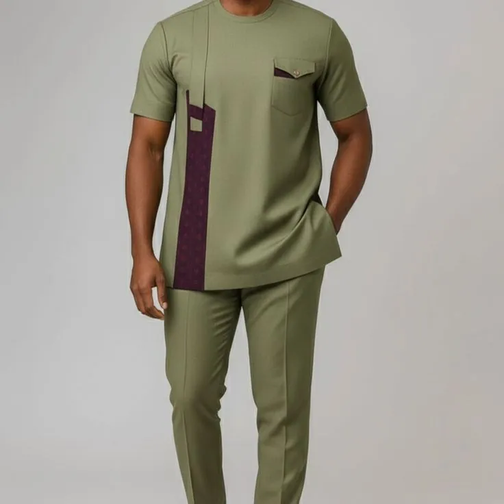 Man in an olive short-sleeve top and trousers with a contrast plum panel